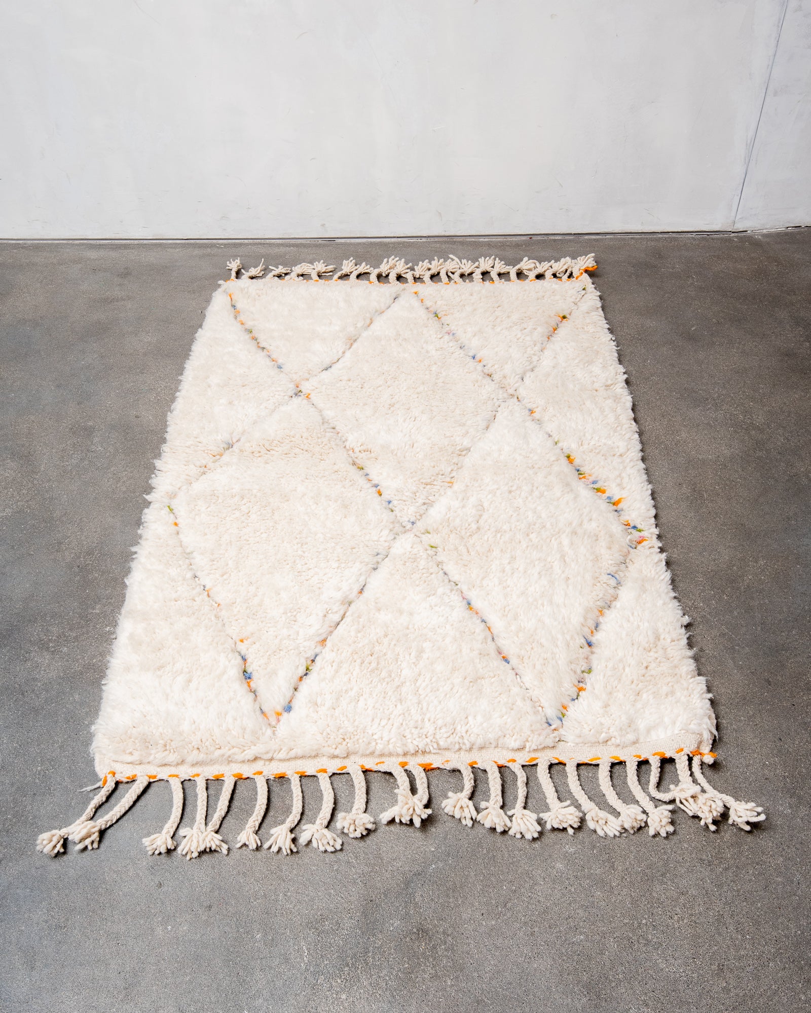Modern, designer, handcrafted Berber rug from Morocco. Beniourain carpet with beautiful colours and patterns and fluffy wool texture.